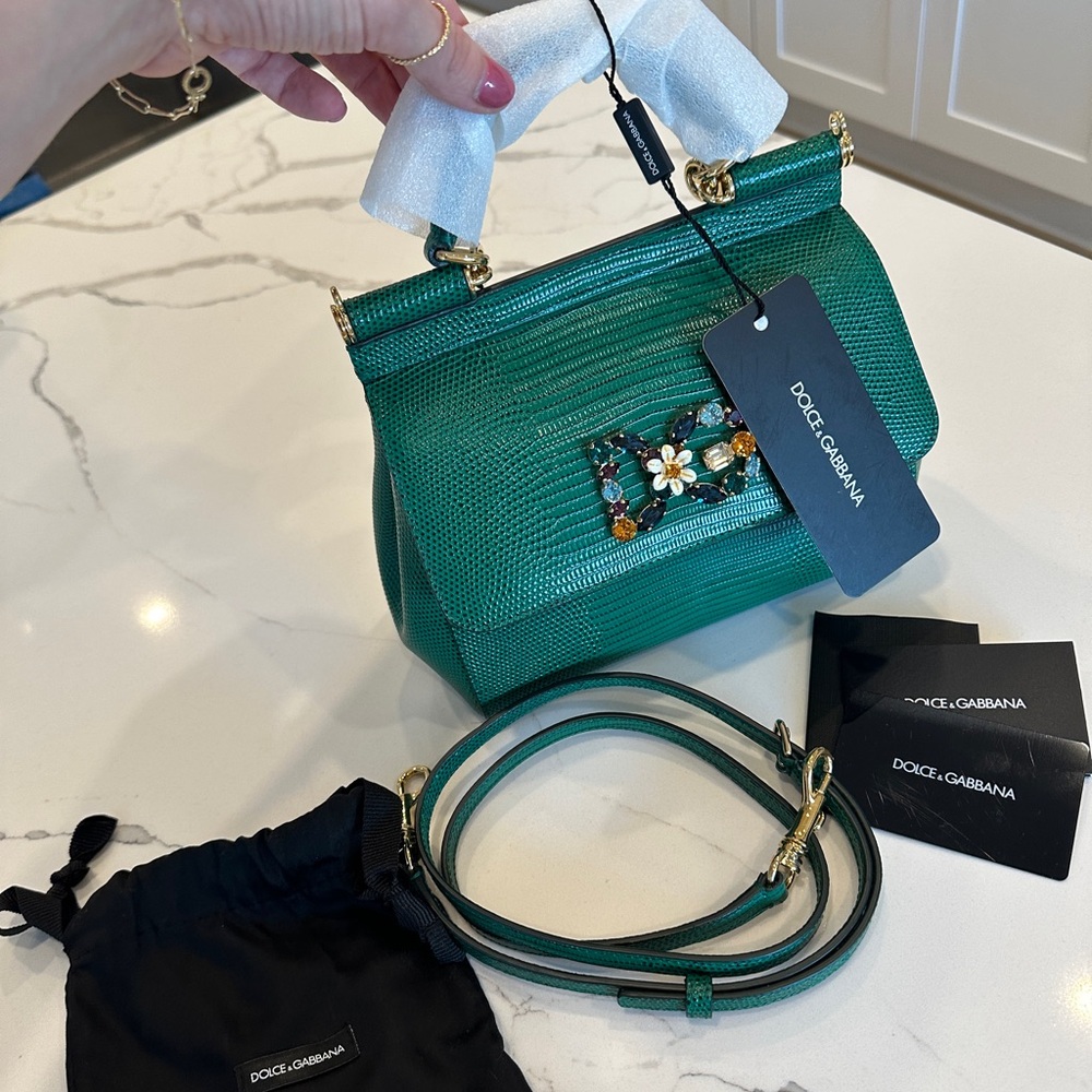 Brand new with foam still in handle. All tags. Bag. Strap.
